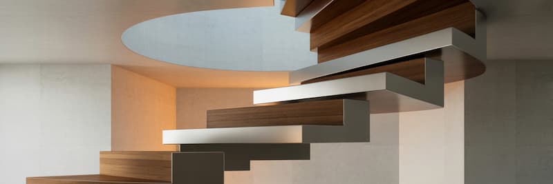 un escalier design qui mélange des matériaux comme le bois et le métal